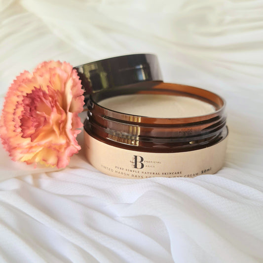 Cosmetic jar beef tallow zinc cream with a pink flower on a white fabric background
